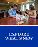 Access information on changes that are new in this catalog.  View of students sitting at a table in a nutrition course.